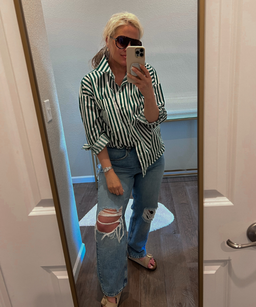 Image of Lindsey Denver wearing a green and white striped top paired with Amazon jeans, showcasing a trendy and stylish outfit.