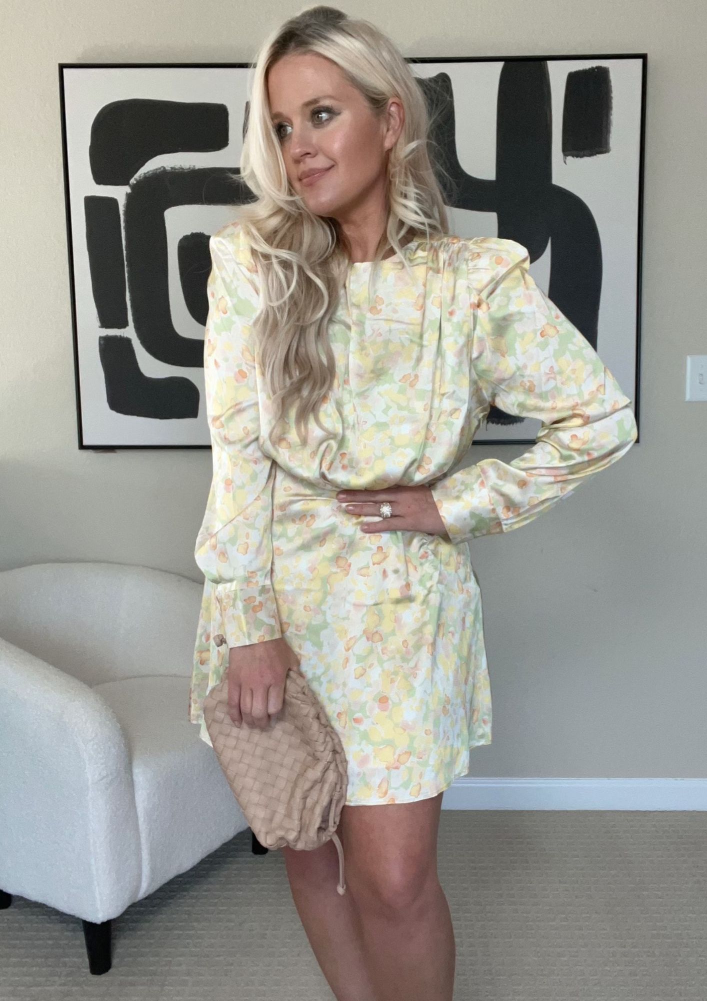 Lindsey Denver wearing yellow floral dress.